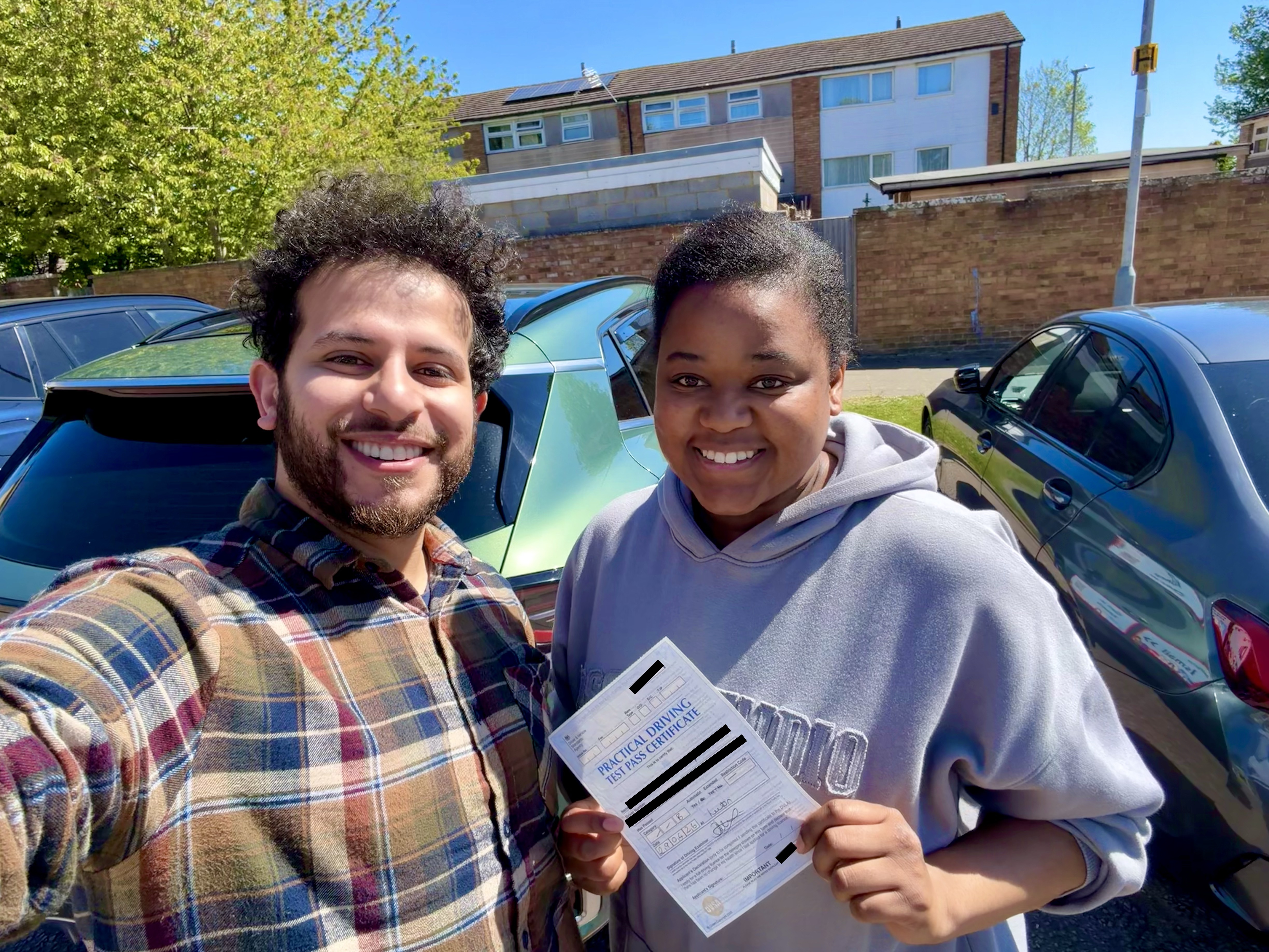Student celebrating their driving test pass