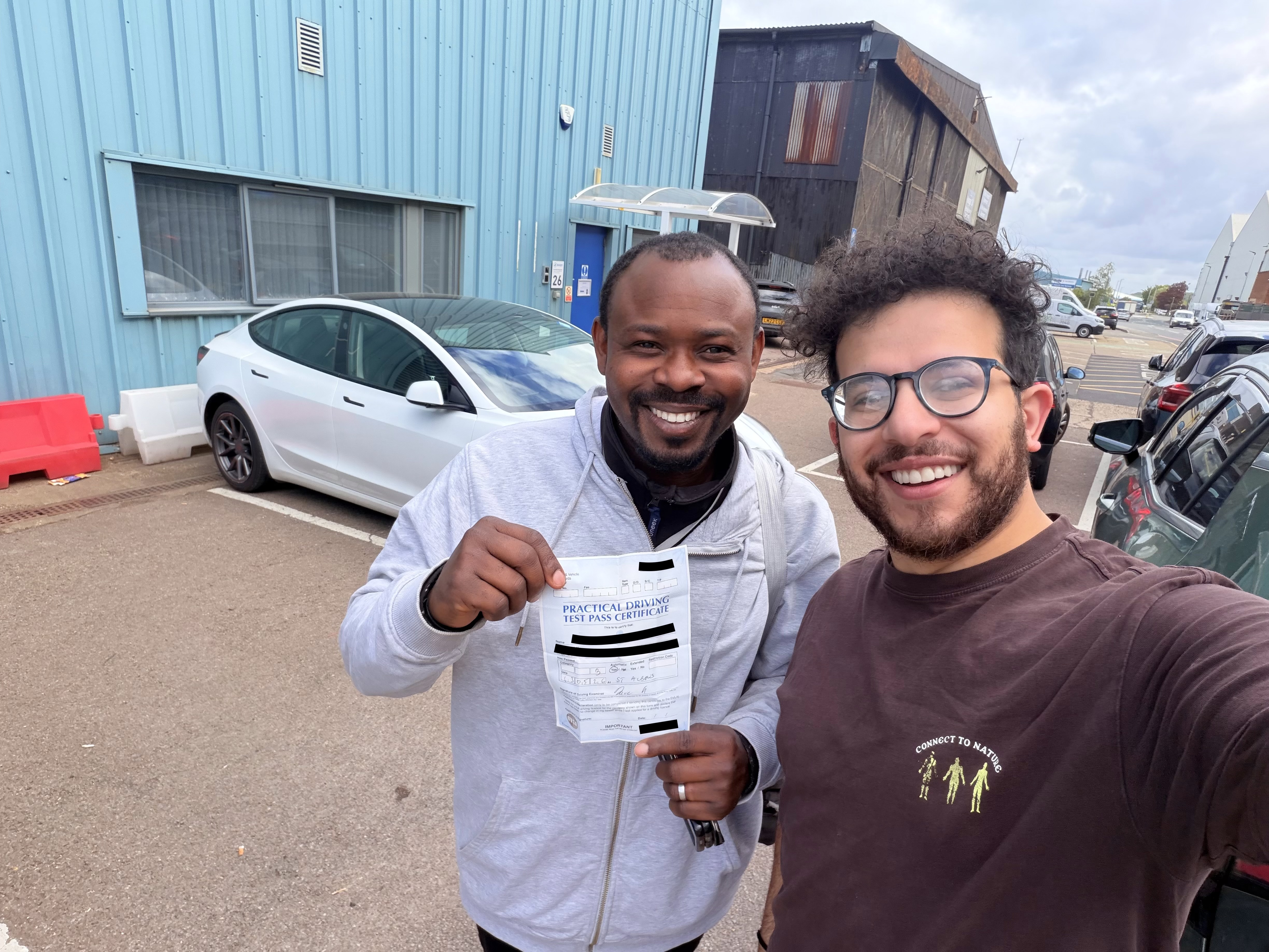 Student with pass certificate at test centre